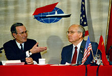 President Bush seated at table with Soviet leader Gorbachev