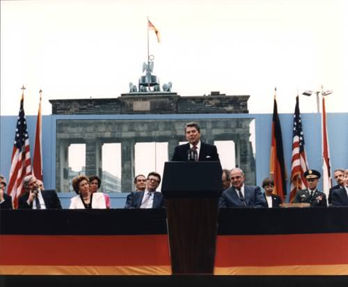 President Reagan standing at podium in front of Berlin Wall